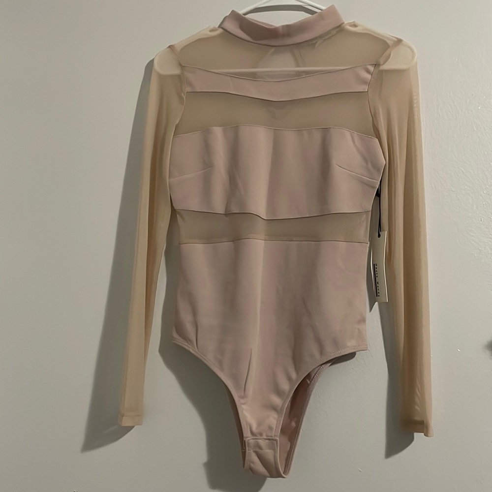 Long sleeve, see through body suit.